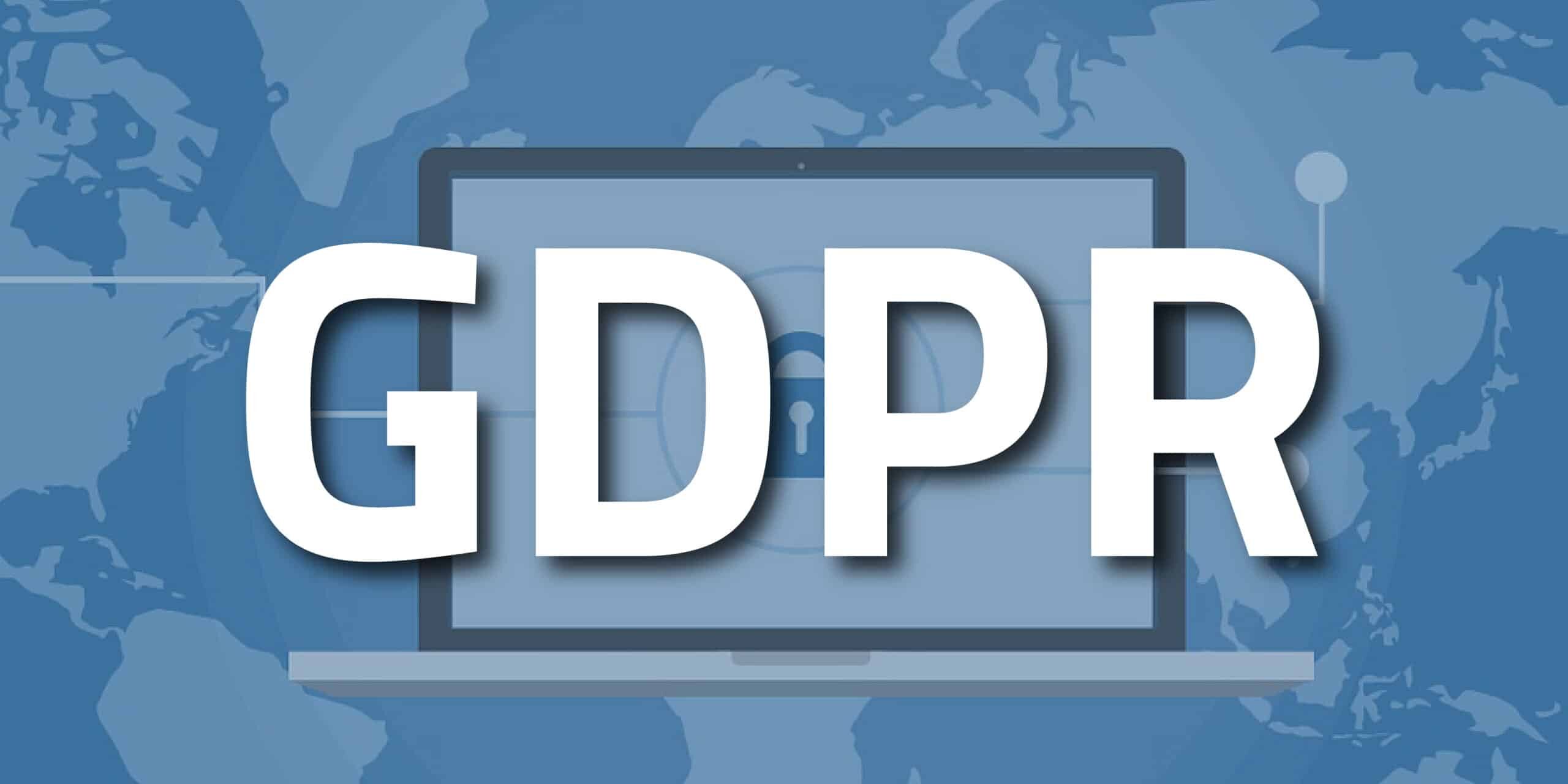 GDPR text over a picture of a laptop with a background of a world map